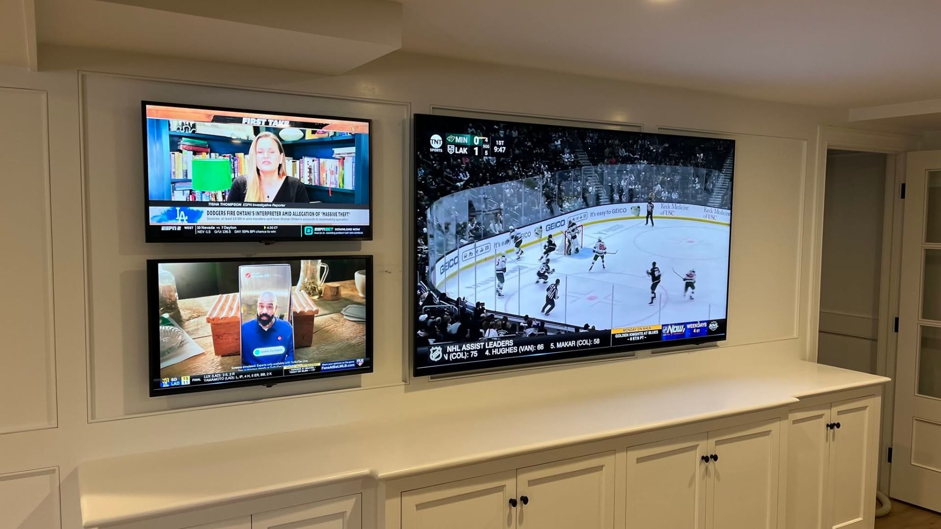 Multi-display sports viewing wall built into custom cabinetry