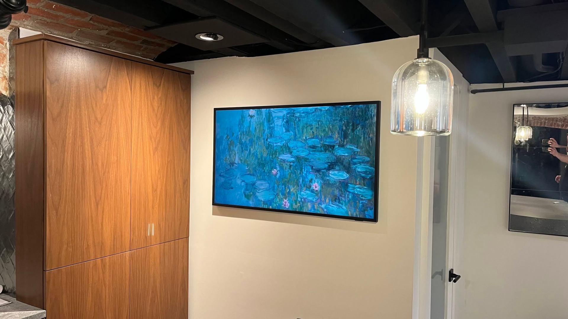 Samsung Frame TV integrated into modern kitchen space
