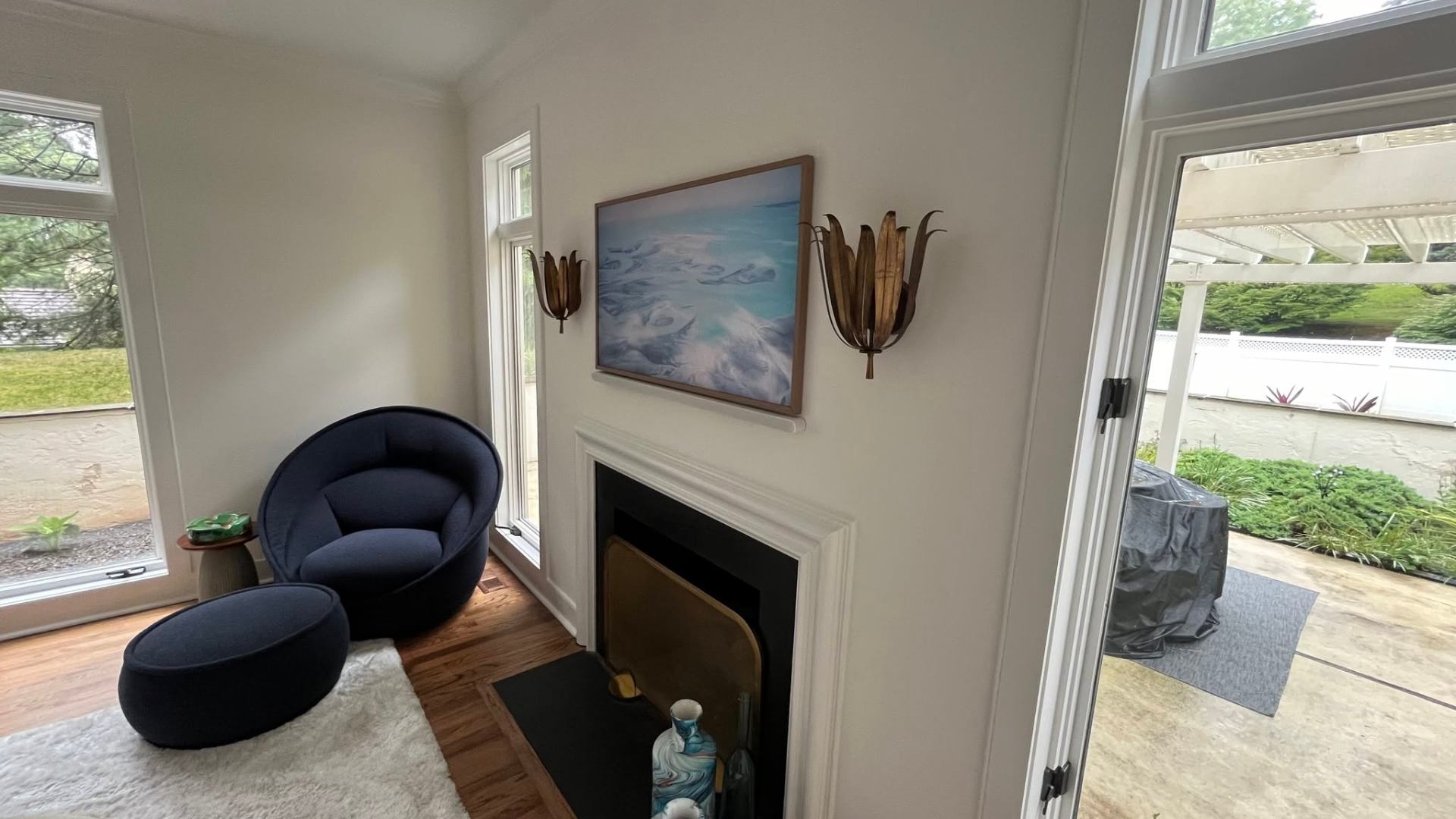 Frame TV over mantle with hidden wiring and sconces
