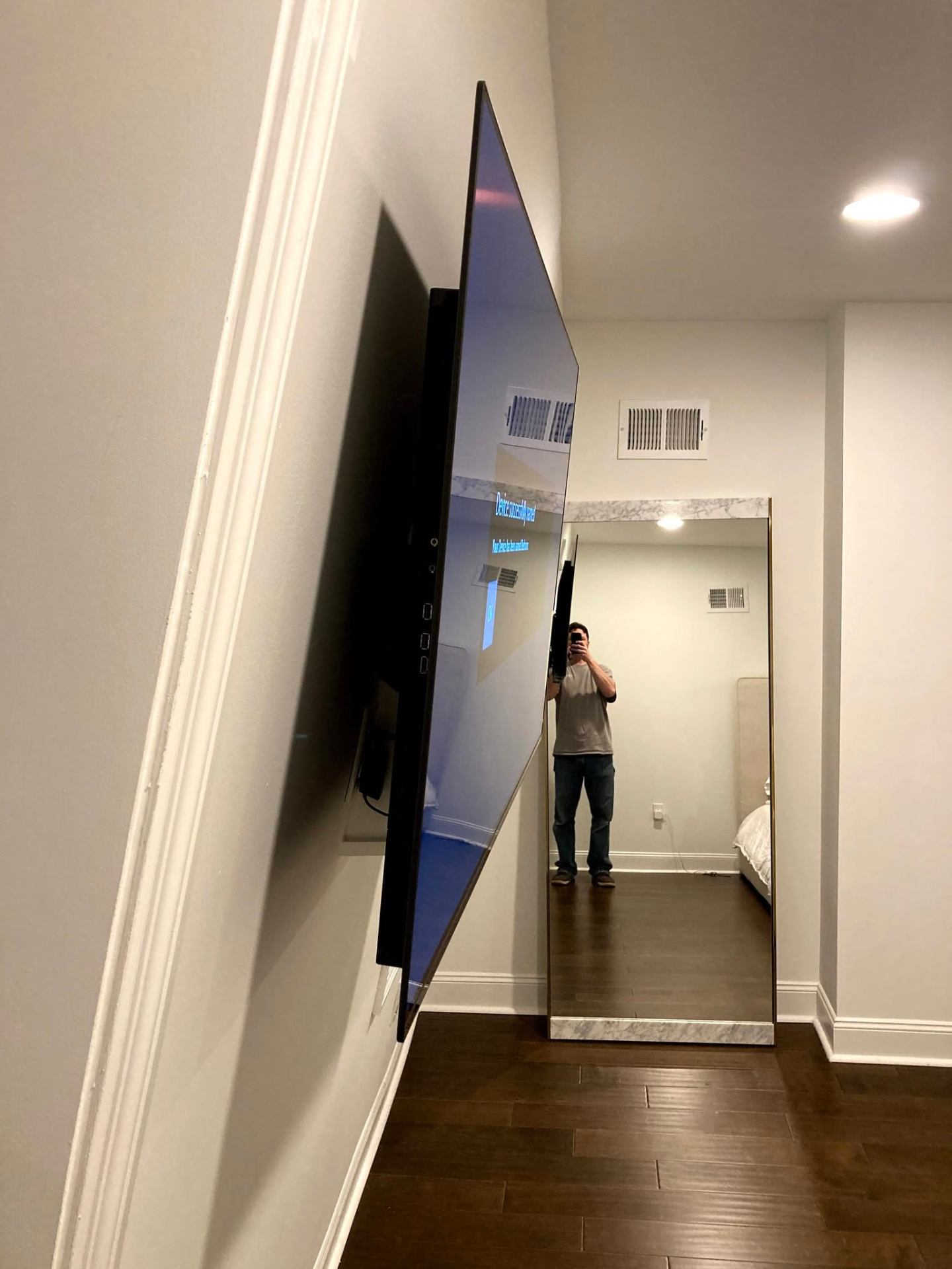 Precision TV mount install with articulated bracket